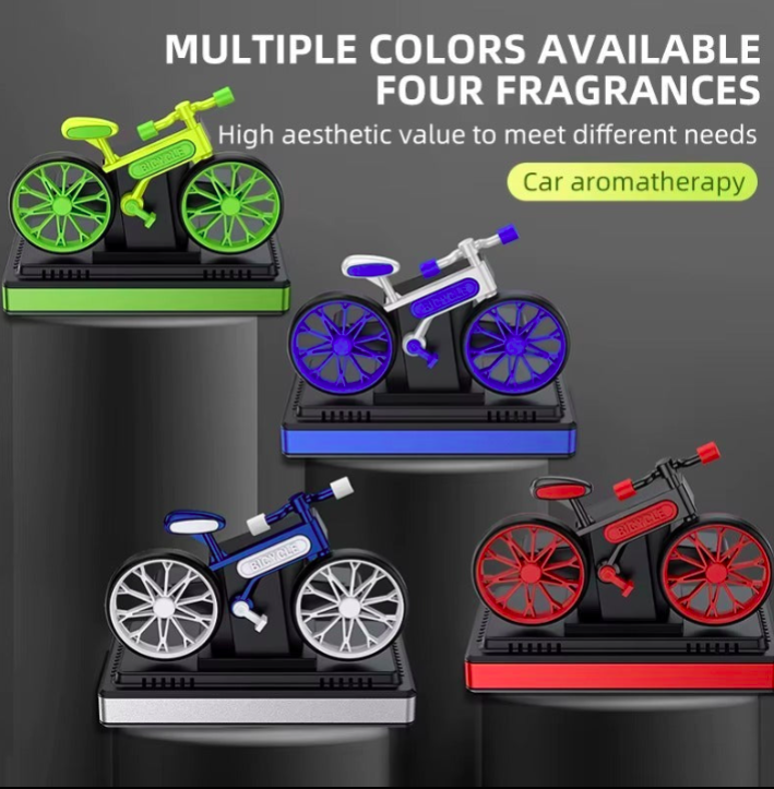Bicycle-shaped car air fresheners in various colors and fragrances on a dark background.