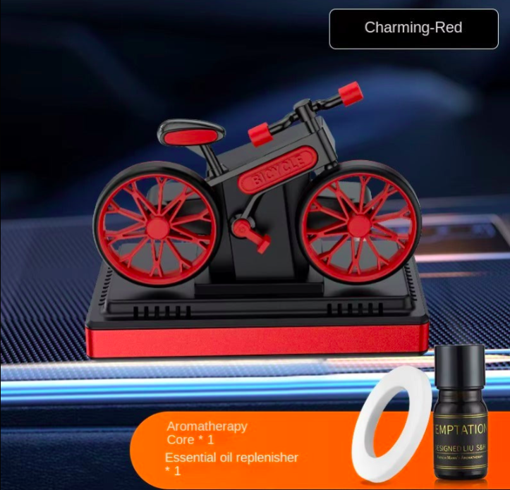 Motorcycle-shaped aromatherapy diffuser with a bottle and ring on a blue background
