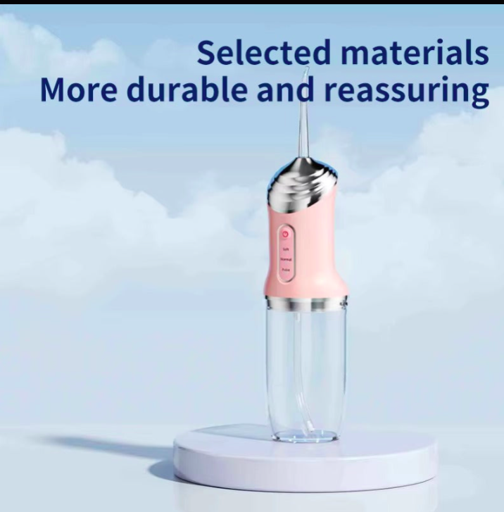 Pink handheld device on a white platform with a blue sky background and text about durability.