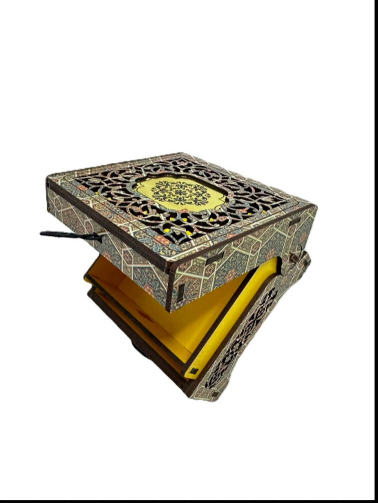 Decorative box with intricate patterns and a yellow interior on a white background