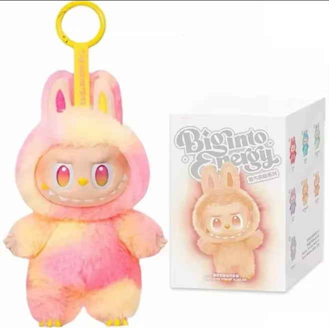 Plush toy with gradient color scheme and packaging labeled 'Big into Energy' on a white background