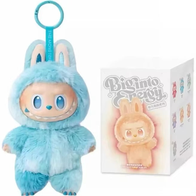 Plush toy in a blue bunny costume next to its packaging with 'Big Into Energy' branding.