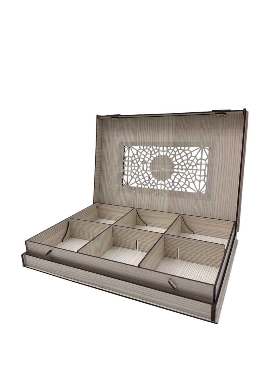 Wooden jewelry box with intricate design on a white background