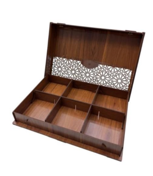Wooden jewelry box with decorative interior on a white background