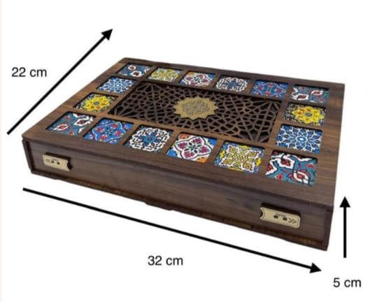 Wooden box with decorative tiles and measurements on a white background