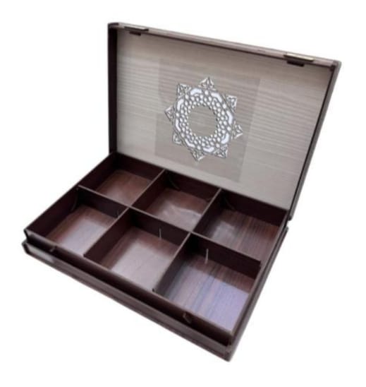 Open wooden jewelry box with compartments on a white background