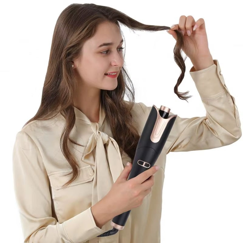 Woman using a hair straightener on her hair against a white background