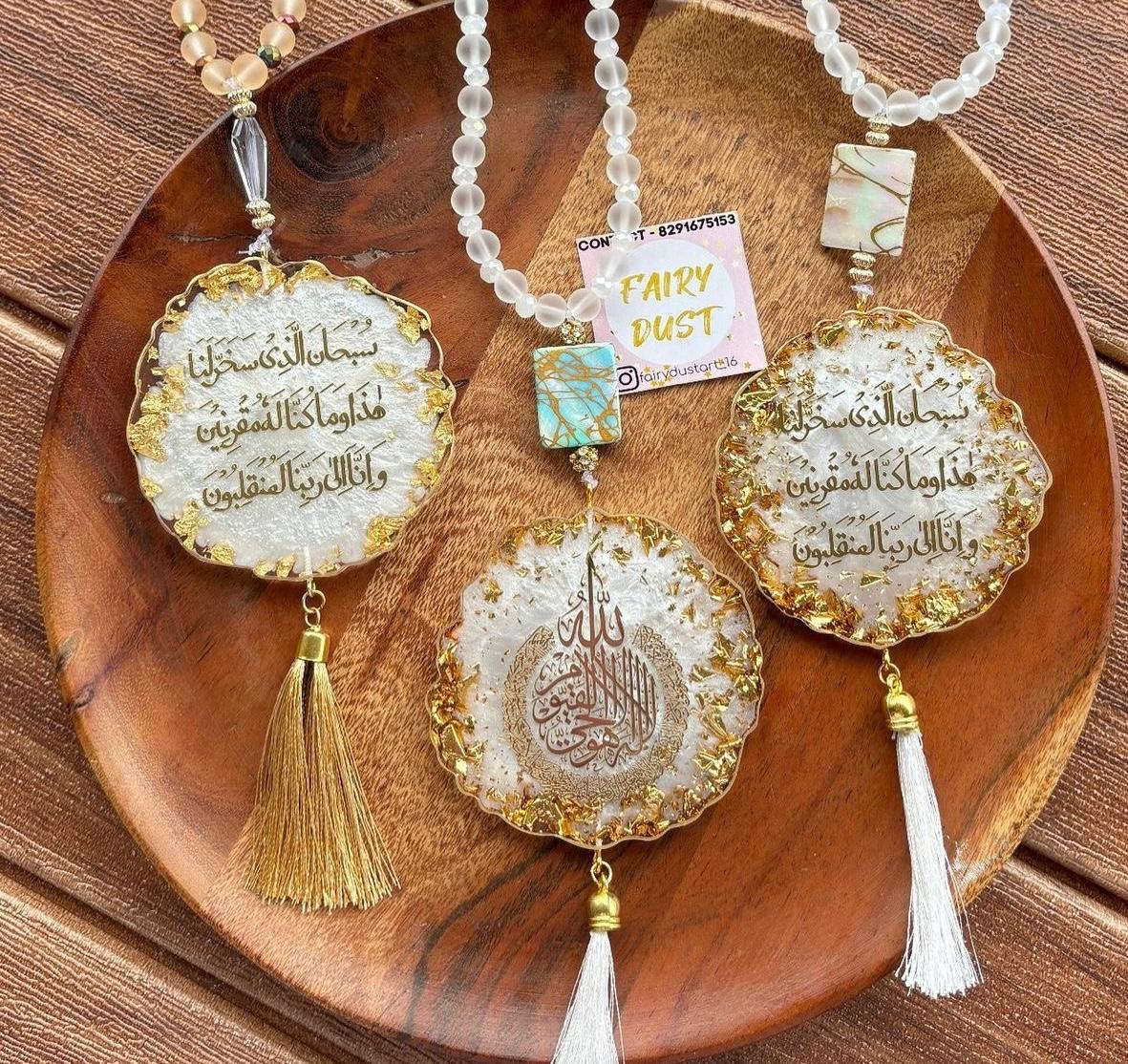 Decorative necklaces with intricate designs on a wooden surface