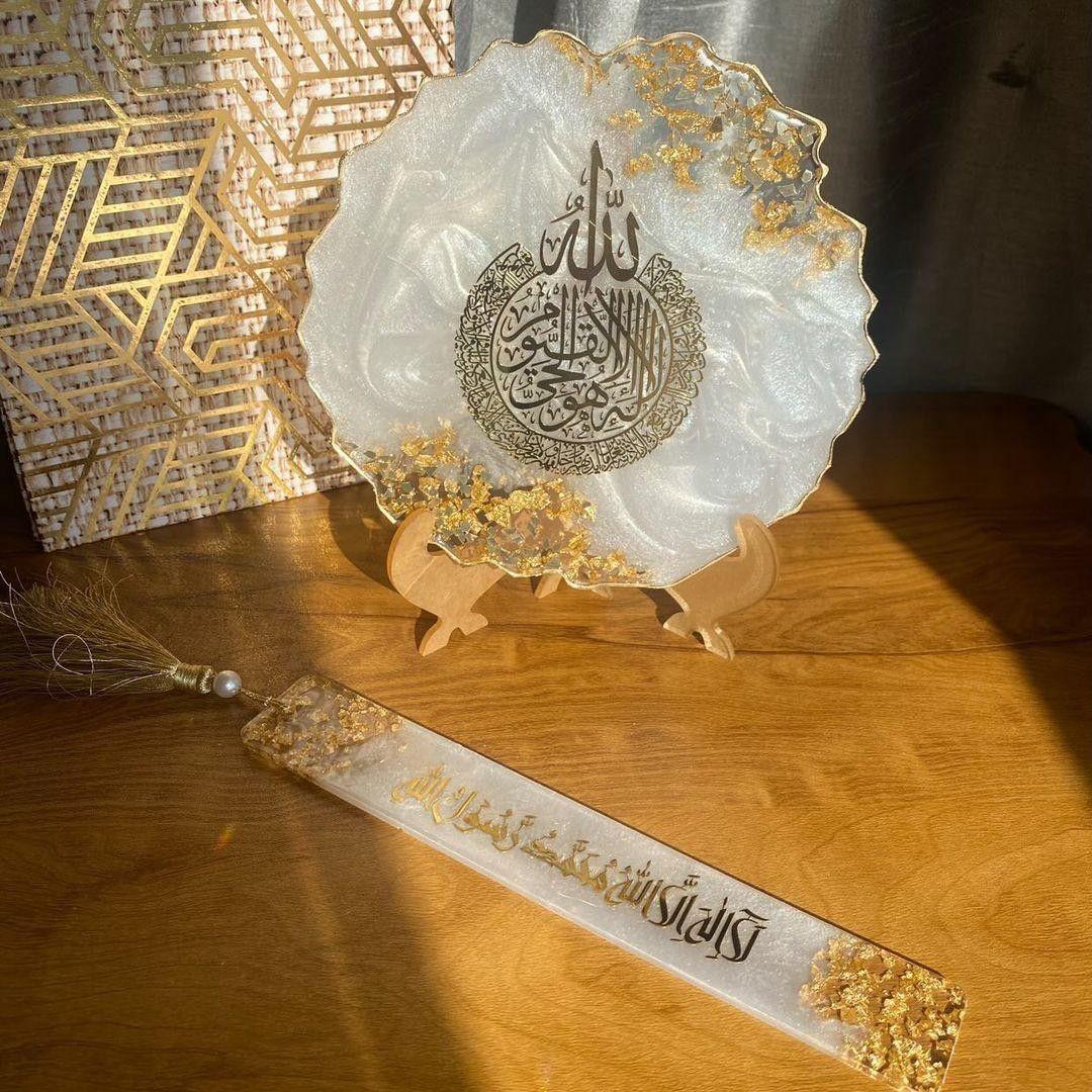 Decorative plate with Arabic calligraphy on a wooden surface