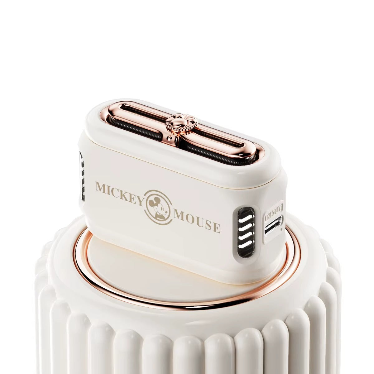 White and rose gold hair dryer with 'Mickey Mouse' branding on a white background