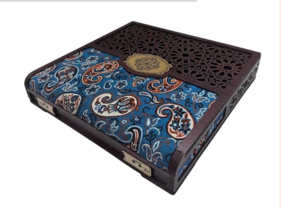 Decorative box with paisley pattern and intricate design on a white background