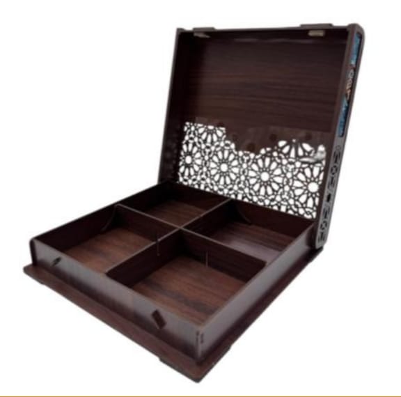 Wooden jewelry box with intricate cut-out design on a white background
