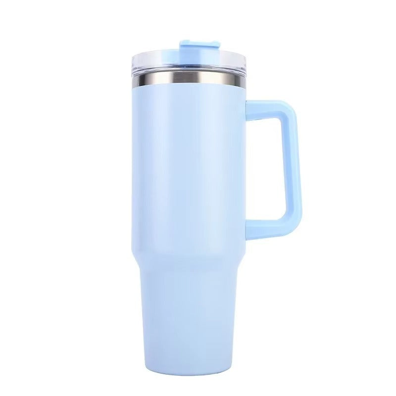 Light blue insulated tumbler with handle on a white background