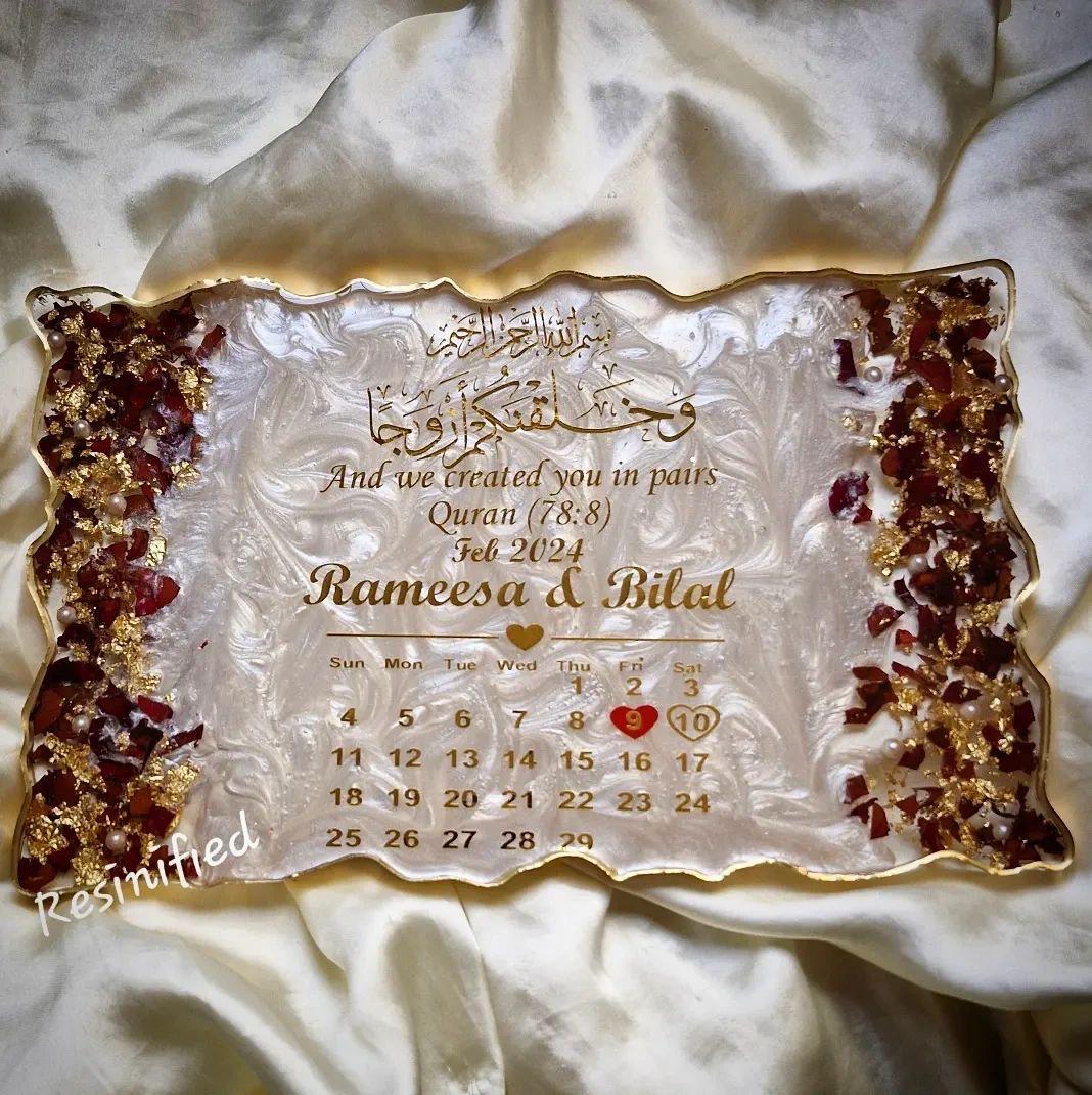 Decorative calendar with intricate design and text on a textured fabric background