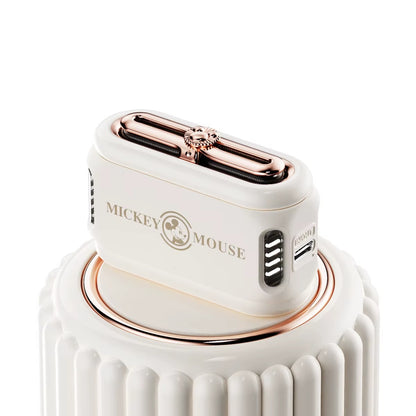 White and rose gold hair dryer with 'Mickey Mouse' branding on a white background