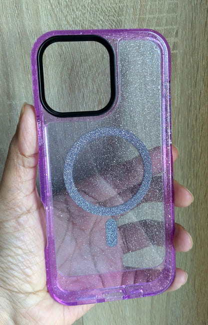 Purple glittery phone case held in a hand with a wooden background